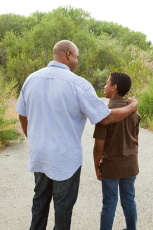 Teen walking with parent