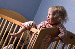 child climbing out of crib